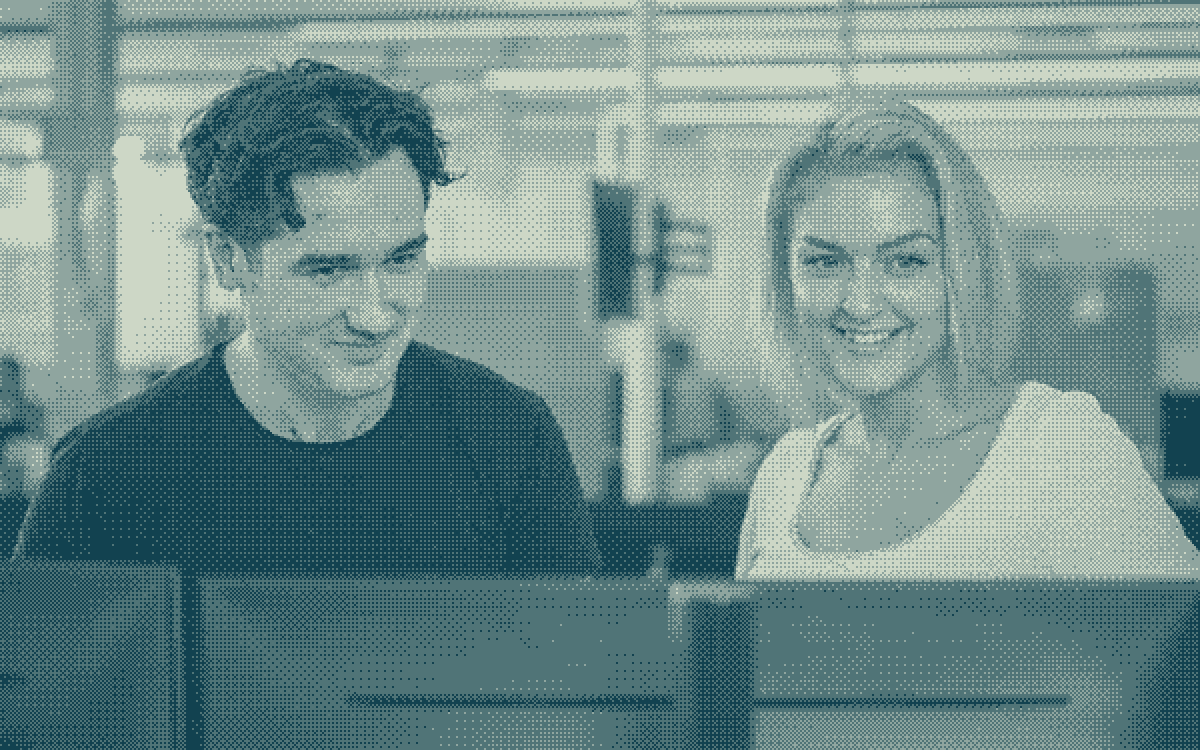 Energi Fyn colleagues working together at their screens.